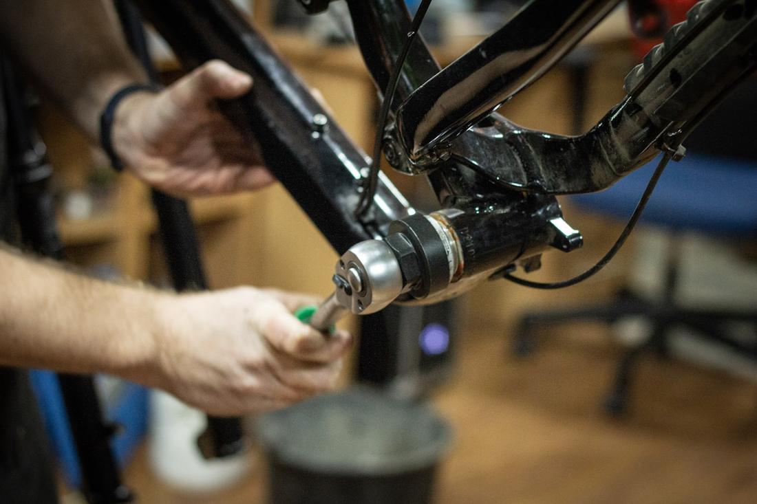 Mechanic working on a bicycle in the workshop